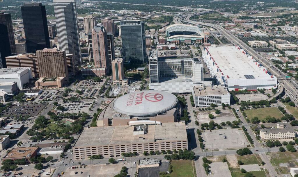 an aerial picture of the Toyota Center in downtown Houston, TX 