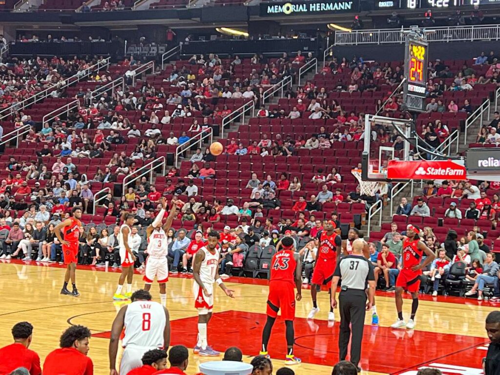 a member of the Houston Rockets takes a free throw against the Toronto Raptors