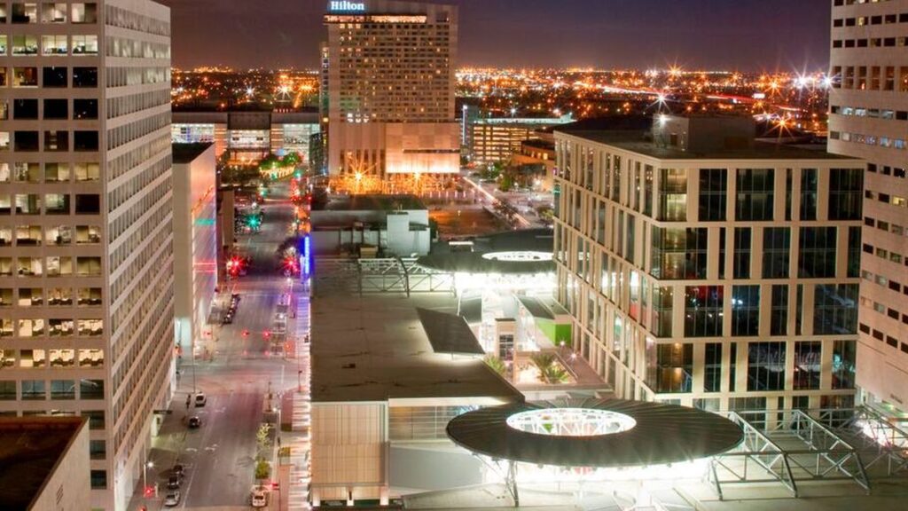 The Hilton Americas - Houston hotel and the Toyota Center (home of the Houston Rockets) are lit up at night