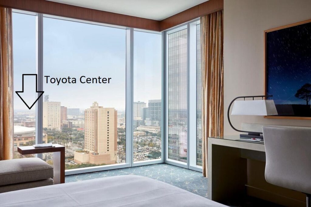 a room at the Marriott Marquis hotel with a view of the nearby Toyota Center arena