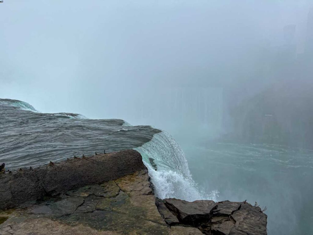 Standing at the edge of Horseshoe Falls in Niagara Falls State Park in Buffalo, NY