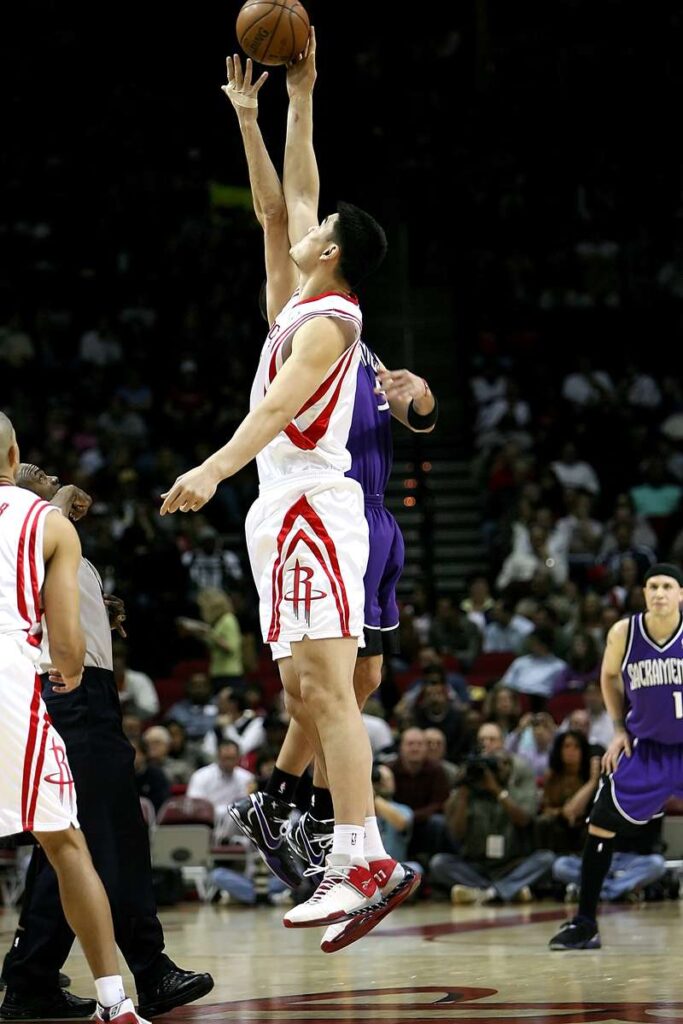 Yao Ming of the Houston Rockets jumps for the basketball at tipoff