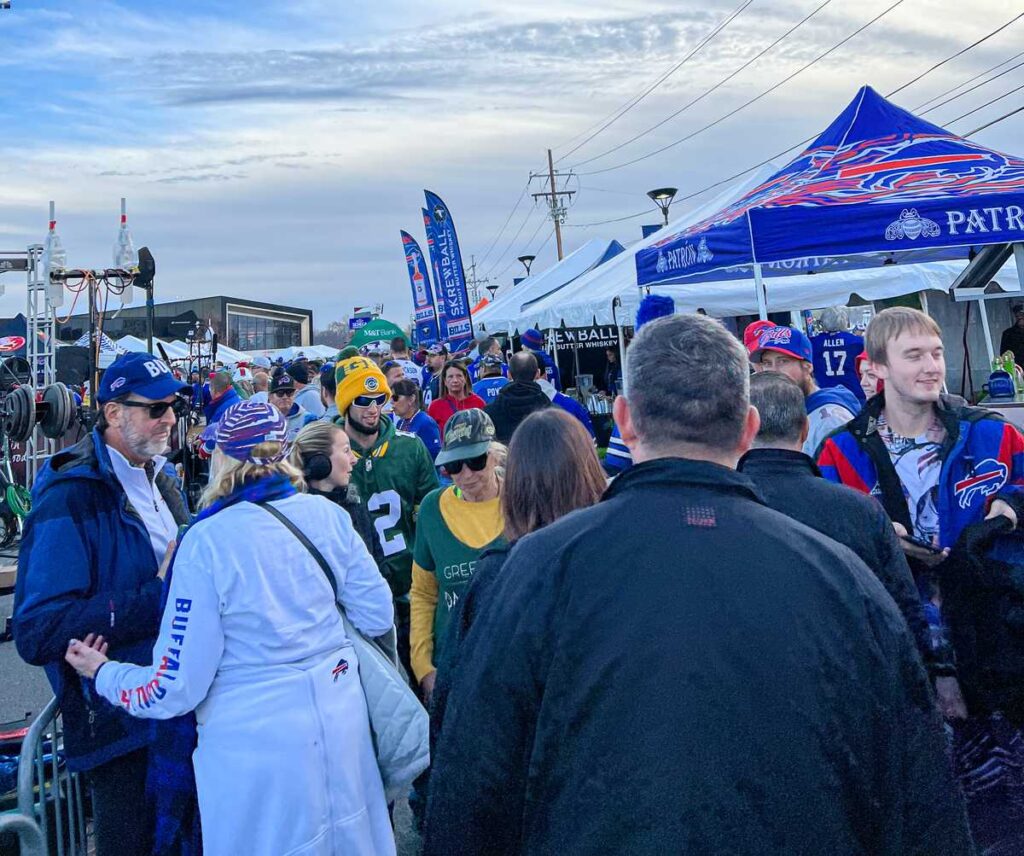 the Bills Mafia mingle with Packers fans in the Billevard outside Highmark Stadium in Orchard Park, NY
