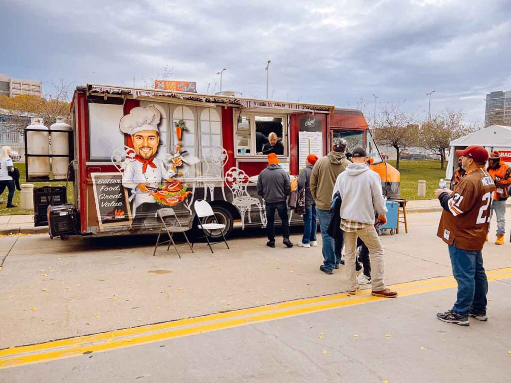 a line-up of Browns fans at a food truck outside the Cleveland NFL stadium.