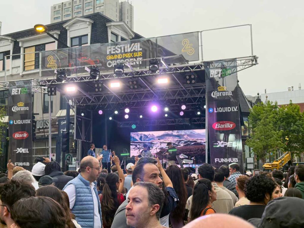 A DJ plays energetic music at the Crescent Street Festival on Saturday night during the Montreal Grand Prix.