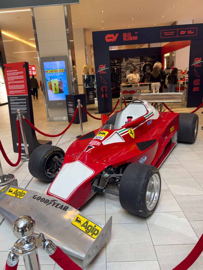 a 1976 Ferrari Formula 1 car on display at the Pit Stop at Eaton Centre in downtown Montreal.