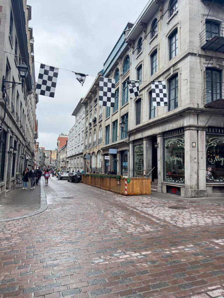 Racing flags decorate Rue St. Paul during the Montreal Grand Prix weekend.