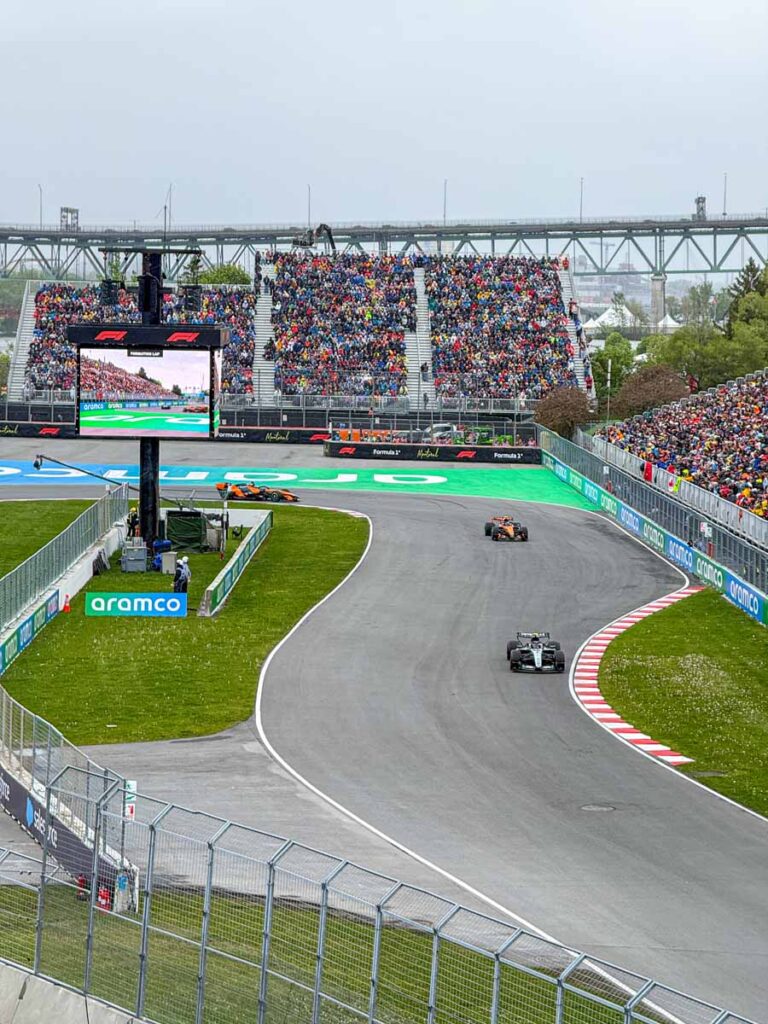 Mercedes and McLaren F1 cars on Circuit Gilles-Villeneuve on the Sunday formation lap before the Grand Prix race.